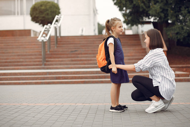 Mother prepare little daughter to school - Valokuva, kuva