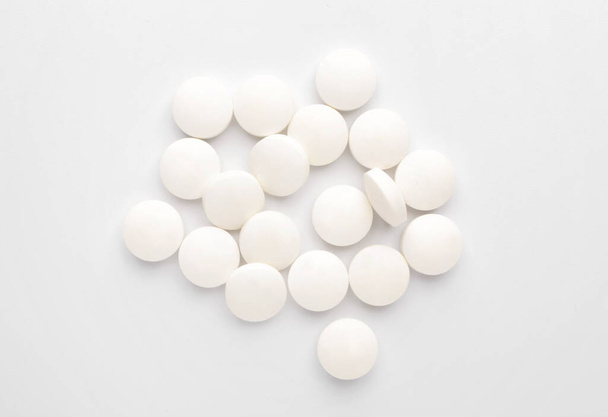 Heap of pills on white background - Фото, изображение