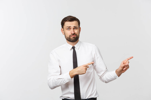 Bearded serious businessman pointing finger at you. Isolated on grey studio background - Photo, Image