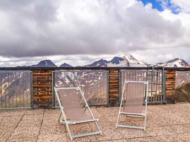 scenic mountain view from panoramic terrace with deck chairs; glacier mount Weisskugel (palla bianca) in the tztal alps, Schnalstal, Sdtirol - Photo, Image
