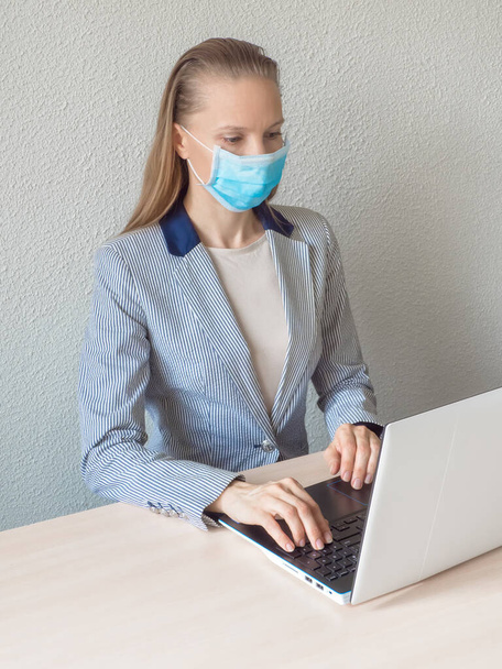 Remote work in quarantine. Computer, laptop and girl studying remotely. Coronavirus pandemic in the world - Φωτογραφία, εικόνα