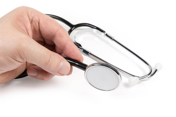 Head chestpiece of modern stethoscope in men's hand against the rest of the device on a white background - Photo, Image