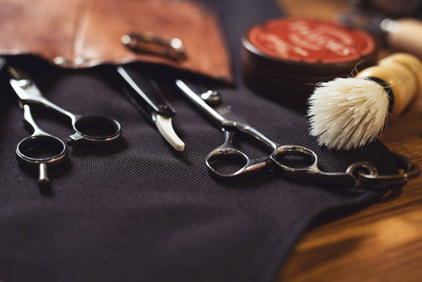 Barber shop equipment on Black background . Professional hairdressing tools.  - Φωτογραφία, εικόνα