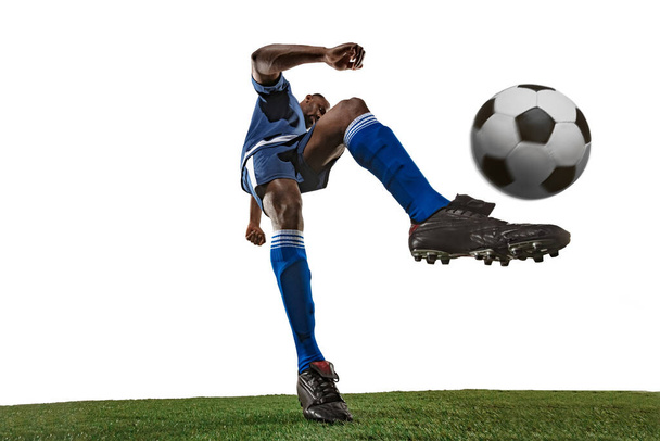 Football or soccer player on white background - motion, action, activity concept, wide angle - Foto, afbeelding