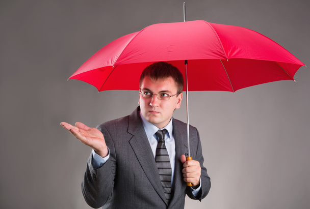 Office worker and umbrella - Foto, afbeelding