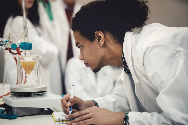 Multicurtural laboratory scientist students working at lab with test tube - Fotografie, Obrázek
