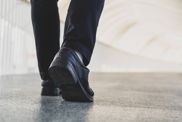 Businessman legs walking in urban city. - Foto, imagen