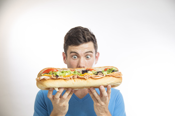 Man Eating a Sandwich - Фото, зображення
