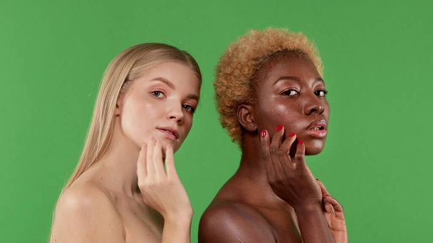 Portrait of beautiful young girls with beautiful skin holding hand near their face. Beauty concept of female body and skin, nude makeup - Φωτογραφία, εικόνα
