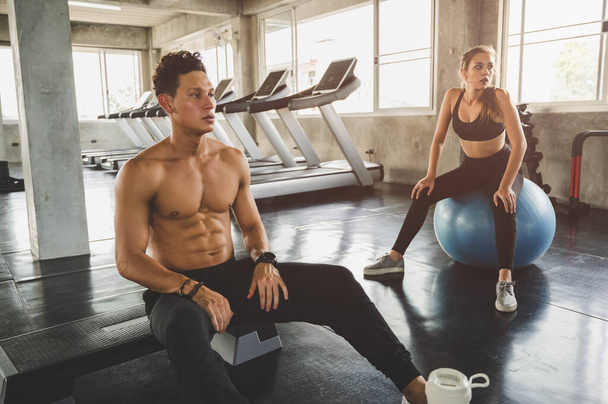 Couple love young fitness man and women workout exercise together. Weight training and cardio program concept. - Fotoğraf, Görsel