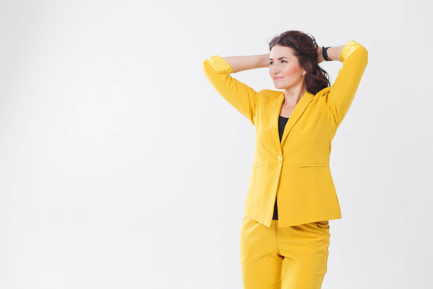 yellow women suit alone isolated - Foto, afbeelding