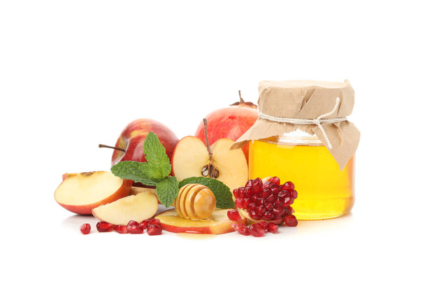 Manzana, granada y miel aisladas sobre fondo blanco. Tratamiento natural
 - Foto, Imagen