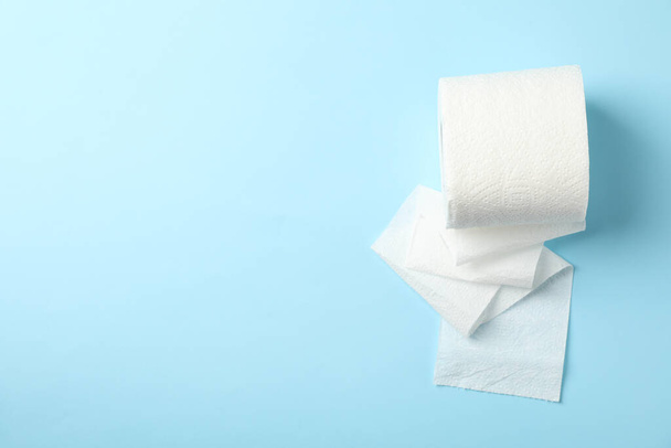 Toilet paper on blue background, space for text - Photo, Image