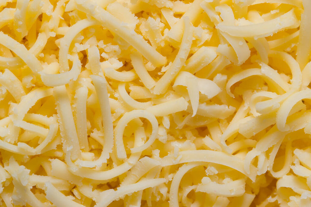 Raastetun juuston tausta makroasteikolla
 - Valokuva, kuva