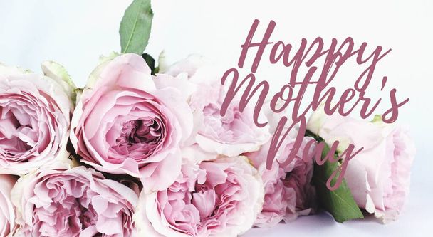 Happy Mothers Day words. Beautiful and tender bouquet of flowers in the hat box, nice present concept, banner size, Greeting card trendy monochrome backdrop. Web banner, Holiday graphic for mom - Photo, Image