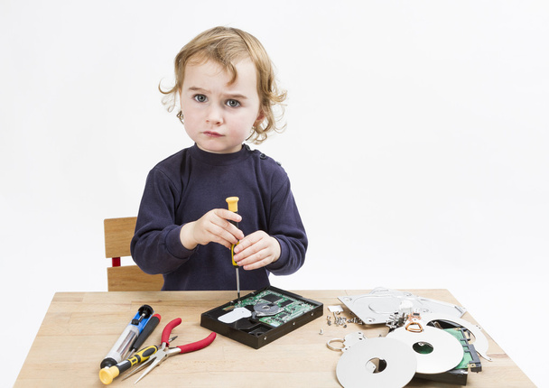 child repairing computer part - Fotó, kép
