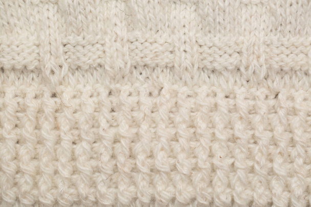 knitted fabric background texture is white. Ornament. - Fotoğraf, Görsel