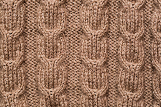 knitted fabric background texture gold. Knitted ornament. - Фото, изображение