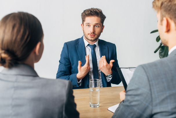 Selective focus of employee pointing on oneself during job interview with recruiters  - Photo, Image