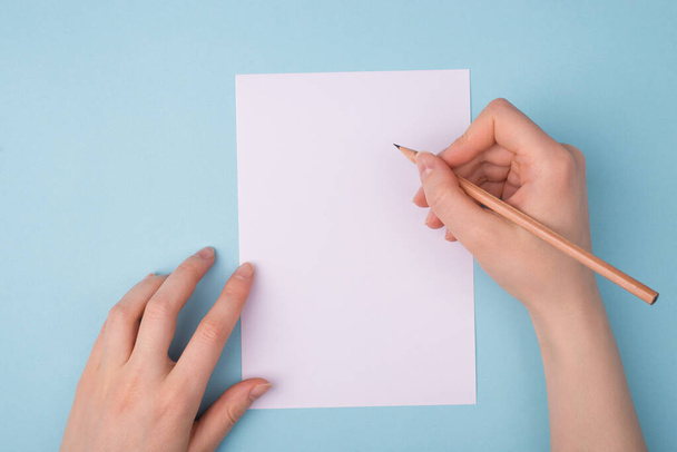 Writing application form or resume cv. Pov first person top above overhead closeup view photo of hands using wooden pencil for taking notes isolated over background empty blank space - Foto, Imagen