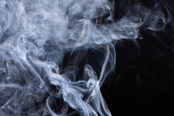 abstract white flowing smoke clouds on black background - Foto, Imagen