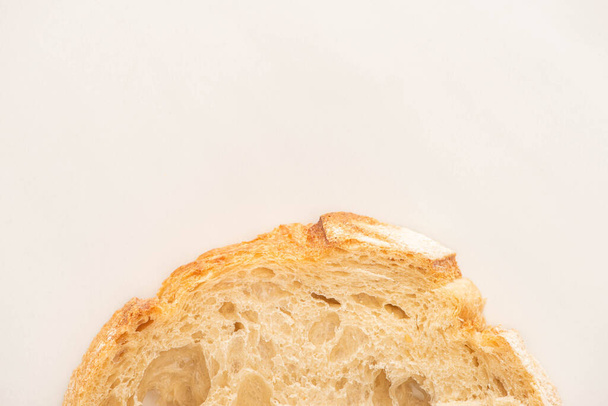 top view of fresh bread slice on white background with copy space - Zdjęcie, obraz