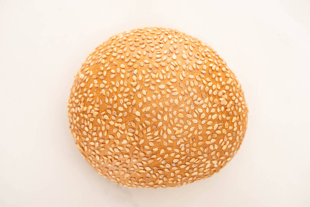 top view of fresh bun with sesame on white background - Photo, Image