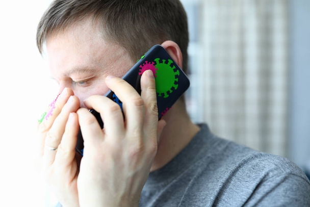 Man speaks on phone infected with coronavirus - Photo, Image