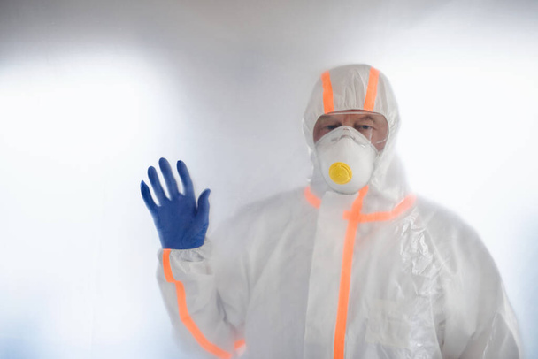 Doctor with protective suit, mask and gloves, coronavirus concept. - Foto, imagen