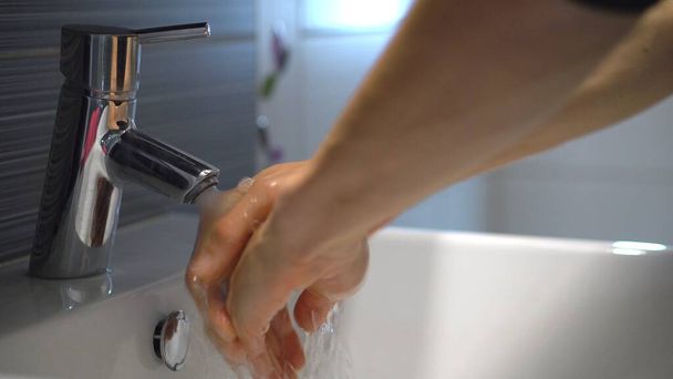 Man washing hands with soap - Фото, изображение
