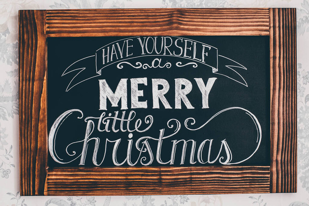 MERRY CHRISTMAS text on wooden desk. Closeup. - Photo, Image