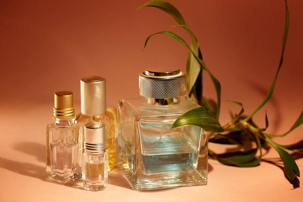 A large bottle of mens perfume and oil for the fragrance. Tropical smell.Aromatherapy, perfumes. - Fotó, kép