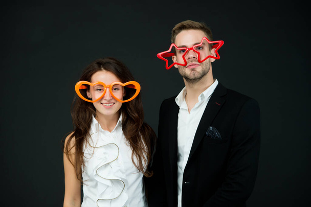 Be my Valentine. Happy couple dark background. Couple in love. Sensual couple wear party glasses. Couple of sexy woman and handsome man. Boyfriend and girlfriend. Valentines day - Photo, Image