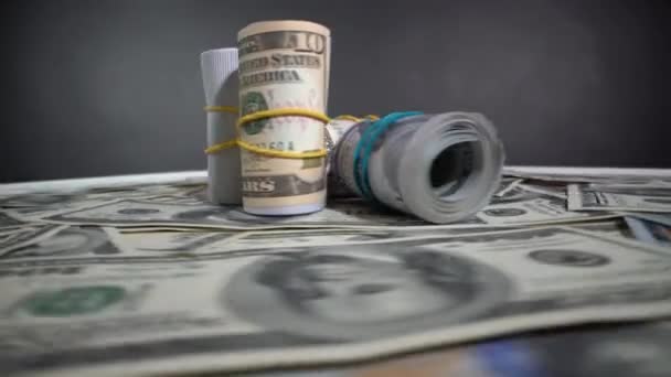 Roll of dollar bills on gray - Footage, Video