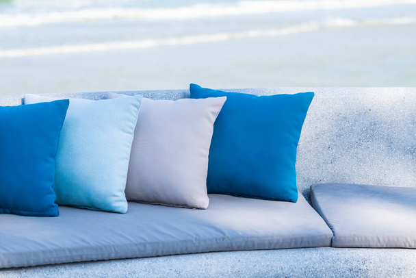 Pillow on chair or sofa lounge around outdoor patio with sea ocean beach view for travel - Photo, Image