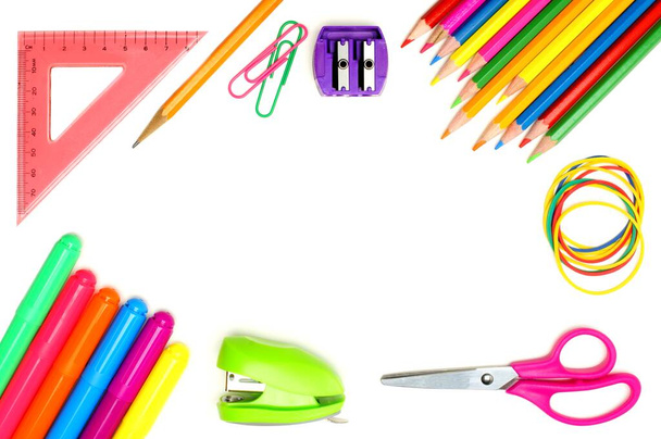 Colorful school supplies frame over a white background - Photo, Image