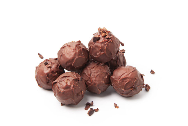 Round-shaped chocolates with nuts on a white background - Valokuva, kuva