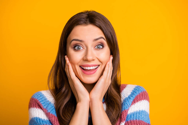Close up photo of cheerful positive girl impressed by long waited present gift she get on birthday celebration wear sweater isolated over bright color background - Foto, immagini