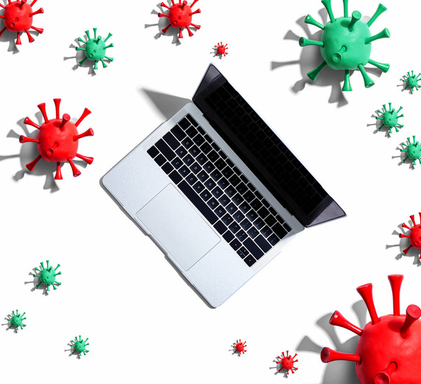 Laptop computer with epidemic influenza concept - Фото, изображение