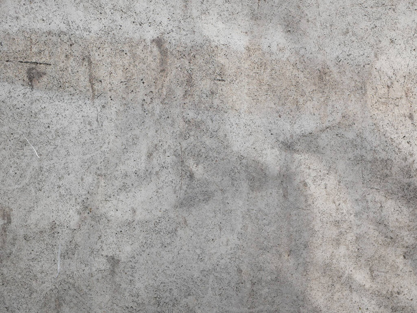 Betonnen muur. Een close-up. metselwerk, materiaal, oppervlakte, vlak, voorkant, uitzicht, patroon, abstract, achtergrond, ontwerp. grijs beton - Foto, afbeelding