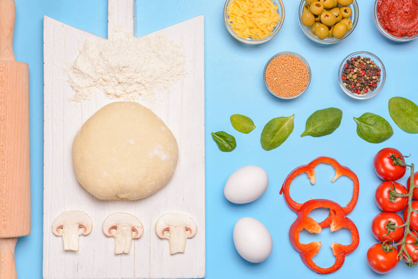 Ingredients for tasty pizza on color background - Photo, Image