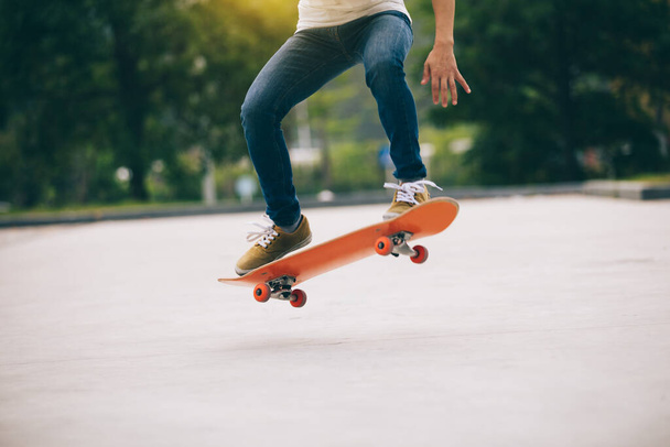 Low section of skateboarder at parking lot in morning - Photo, Image