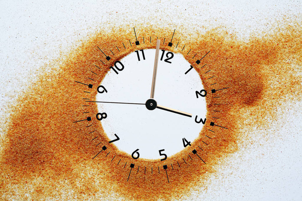 Abstract composition with clock dial inside sand flowing background - Photo, Image