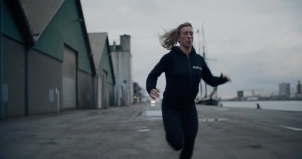 Athlete Running Along Path At Docks - Materiał filmowy, wideo