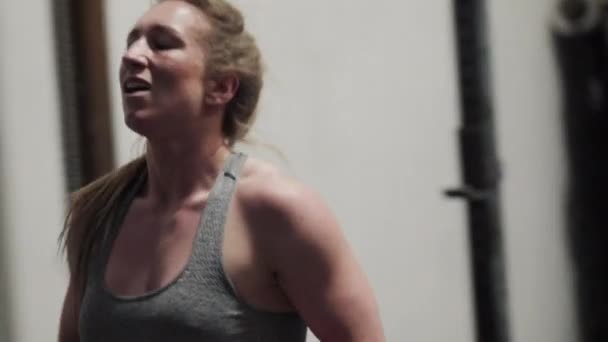 Female Athlete Walking In Gym - Materiał filmowy, wideo