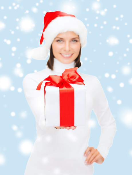 Woman in santa helper hat holding gift box - Photo, Image