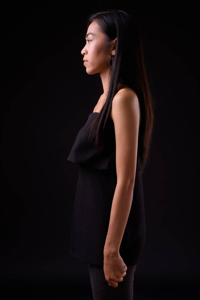 Profile view of young beautiful Asian woman - Photo, Image