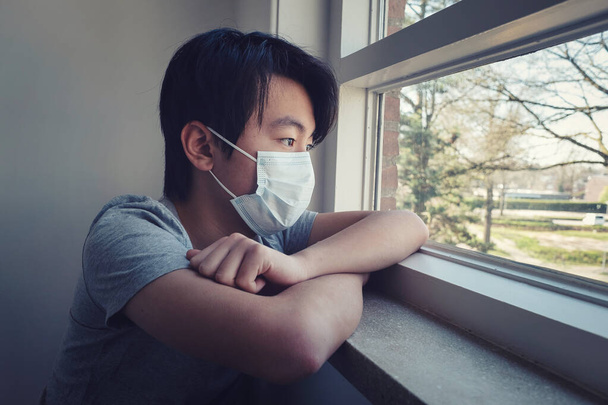 Young Asian boy in home quarantine - Fotó, kép
