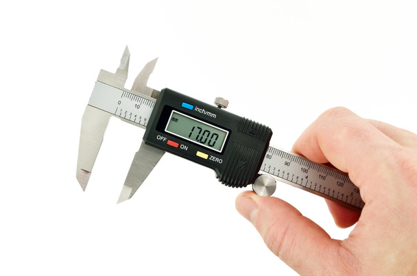 calibradores de medición en mano listos
 - Foto, imagen