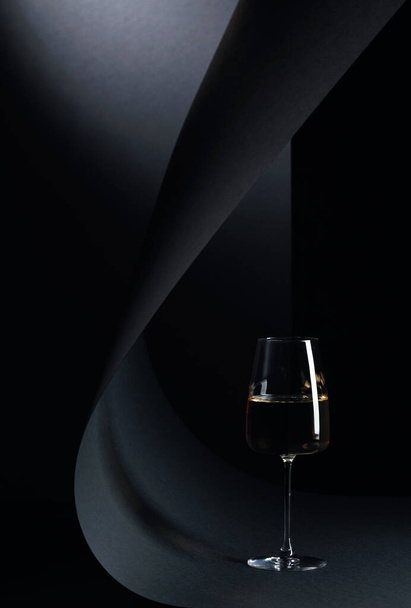 Glass of white wine on a black background. Copy space. - Photo, Image